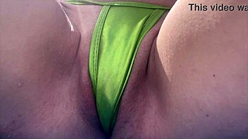 Check out this Italian milf flashing her tight shaved pussy at Miami's public beach! So hot!