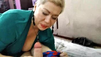 Aimee, the mature cocksucker, gets close-up action with her neighbor's dick.