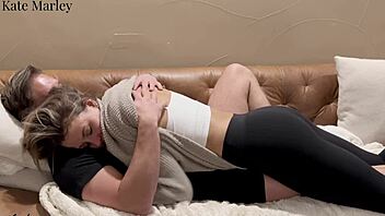 Kate Marley rides on the couch passionately.