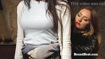 mistress punishes slave with strapon in bondage scene