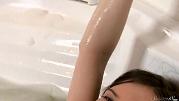 Brunette young whore masturbates in bath. Want to join?