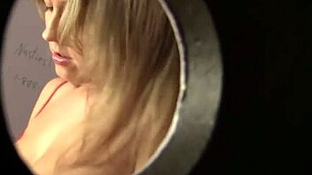 Blonde Nina Rae sucks big dick from glory hole while using toy.