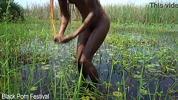 slim african woman with a nice soft butt bathing in the river