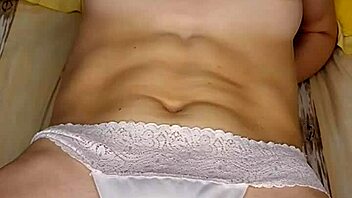 Watch this blonde girl in lingerie fuck herself with a big pink dildo