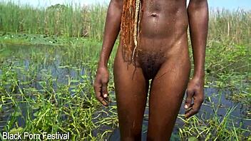 slim african woman with a nice soft butt bathing in the river