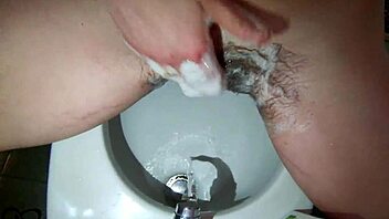 Housewife with braces flashes in the bathroom