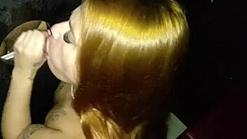 Redhead girlfriend sucks stranger's dick in gloryhole while cuckold boyfriend films