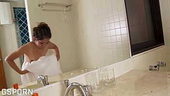 Hot Asian Thai girl toys hairy pussy in bathroom. Does she get caught wet?