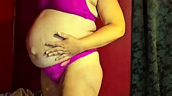 Preggo MILF strips showing tender nipples