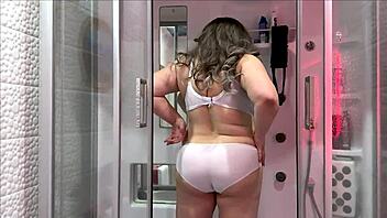 Mature stepmom asks stepson to rub her back in shower.