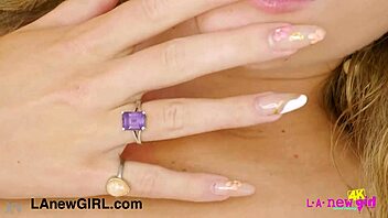 lovely blonde beauty reveals gorgeous figure on sofa