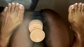 Ebony Takes Dildo Deep in Pussy