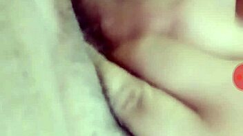 A person is masturbating privately in their room