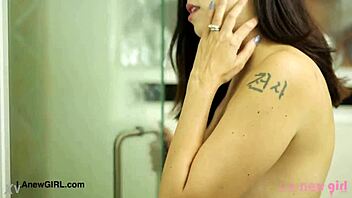 Smoldering brunette beauty relaxes on sofa after shower