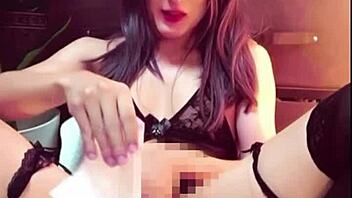 Japanese ladyboy masturbates in public toilet