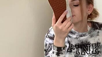 A Serbian girl removes her sneakers to reveal her bare feet.