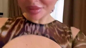 Spilling water on wet big natural tits in the kitchen