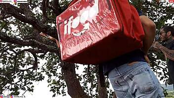 Public encounter with blonde and brunette on tree.