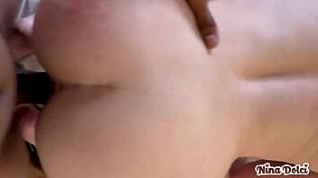 Horny MILF Nina Dolci catches bellboy stroking slowly in bedroom