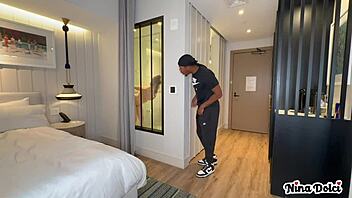 Horny MILF Nina Dolci catches bellboy stroking slowly in bedroom