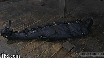 A restrained girl gets punished in the garage