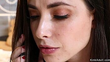 brunette lesbian fists stepmom's ass in bondage scene