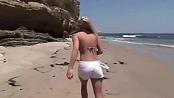 Little summer shares her natural tits and pussy at the beach