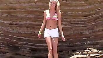 Little summer shares her natural tits and pussy at the beach