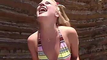 Little summer shares her natural tits and pussy at the beach