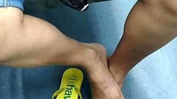 candid brazilian girl playing with flip flops