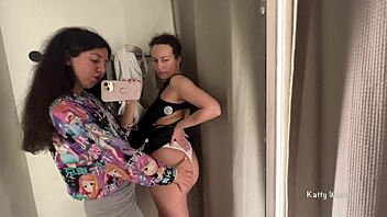 Two horny bitches are kissing in the public locker room with big tits