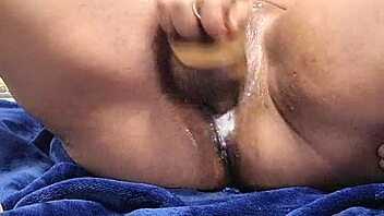 Homemade close-up of oiled pussy stretching with dildo