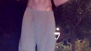 Athletic black guy picks up cute brunette for a workout session.