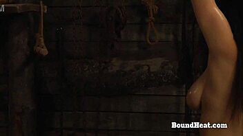 Look at this curvy lesbian slave getting washed and oiled for bondage domination.