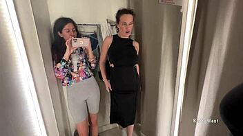 Two horny bitches are kissing in the public locker room with big tits