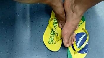 candid brazilian girl playing with flip flops