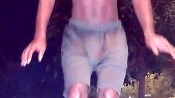 Athletic black guy picks up cute brunette for a workout session.