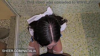 student in uniform fucks her teacher in the bathroom, spreading legs and spitting on pussy