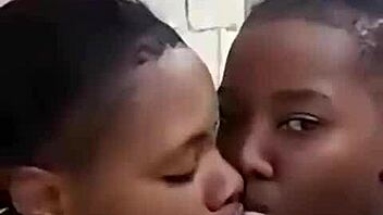Two liberian lesbians kiss and lick in uncompleted building