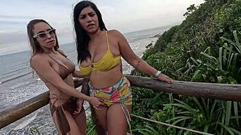 Priscila and Nicoly, two naughty girls, have a wild public fuck on the beach in nature.