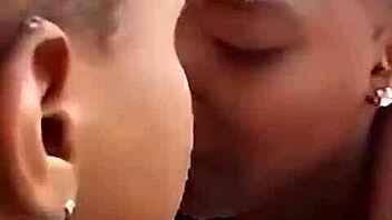 Two liberian lesbians kiss and lick in uncompleted building