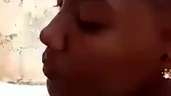 Two liberian lesbians kiss and lick in uncompleted building
