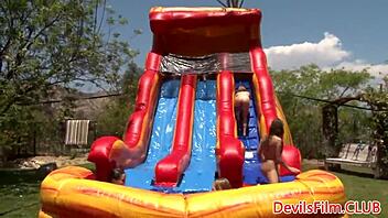 Wet Lesbians Are Strapon Fucking In This Outdoors Orgy