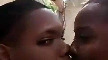 Two liberian lesbians kiss and lick in uncompleted building