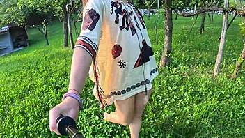 Beautiful brunette undresses barefoot in nature, showing juicy cameltoe and naked body!