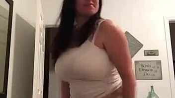 Stripping at home with clothes ripped.