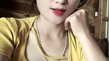 Vietnamese girl dances sexily to music in casual setting