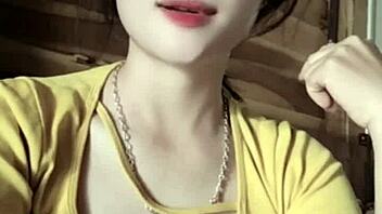 Vietnamese girl dances sexily to music in casual setting