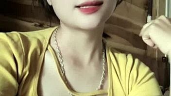 Vietnamese girl dances sexily to music in casual setting