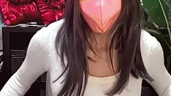 Masked Beautiful Woman In Crossdressing Masturbates While Streaming Live